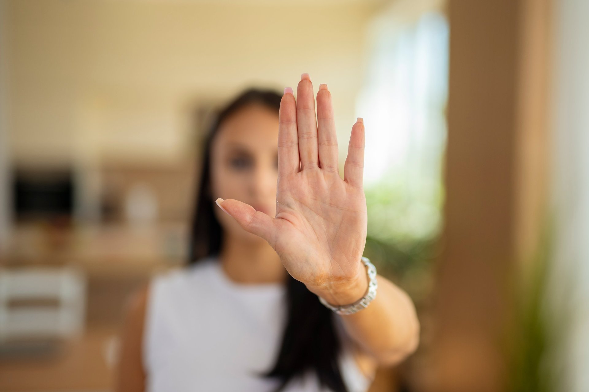 Woman displaying a gesture indicating no or stop